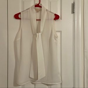 White sleeveless MK blouse with tie in front